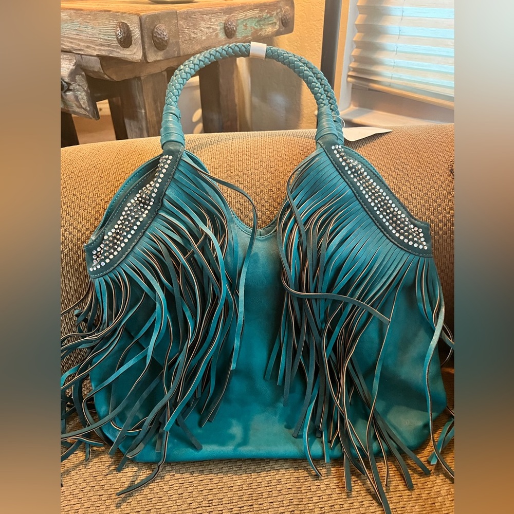NWT fringe & rhinestone turquoise colored shoulder purse. Free gift w/ purchase